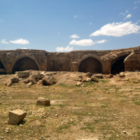 The Han-el Barür Caravanserai bears an inscription declaring that it was erected in 1128-29 by el Hac Hüsameddin ali Bey Imad Bin Isa.